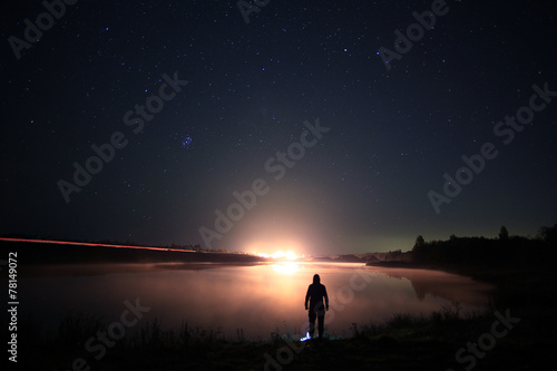 night man at Lake starry sky space alien