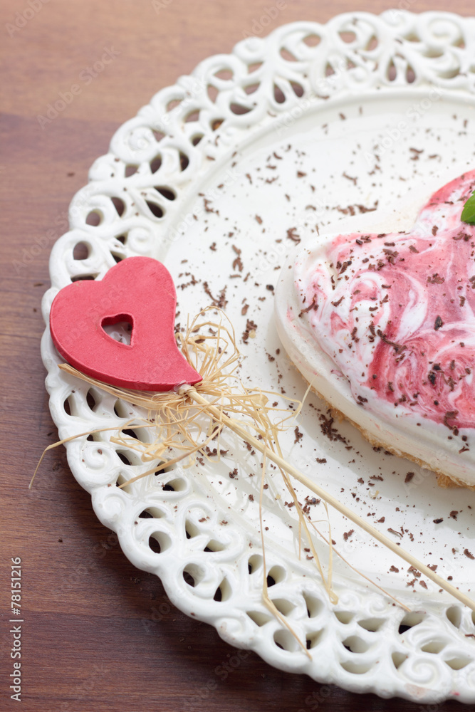 Meringue shaped heart on a ornamental plate. Meringue shaped heart on a ornamental plate.
