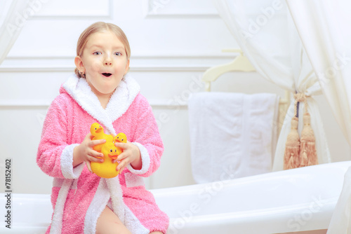 Fotografie Cute little girl in the bathroom
