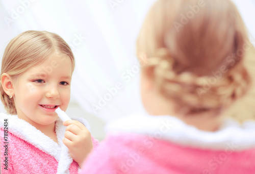 Cute little girl in the bathroom