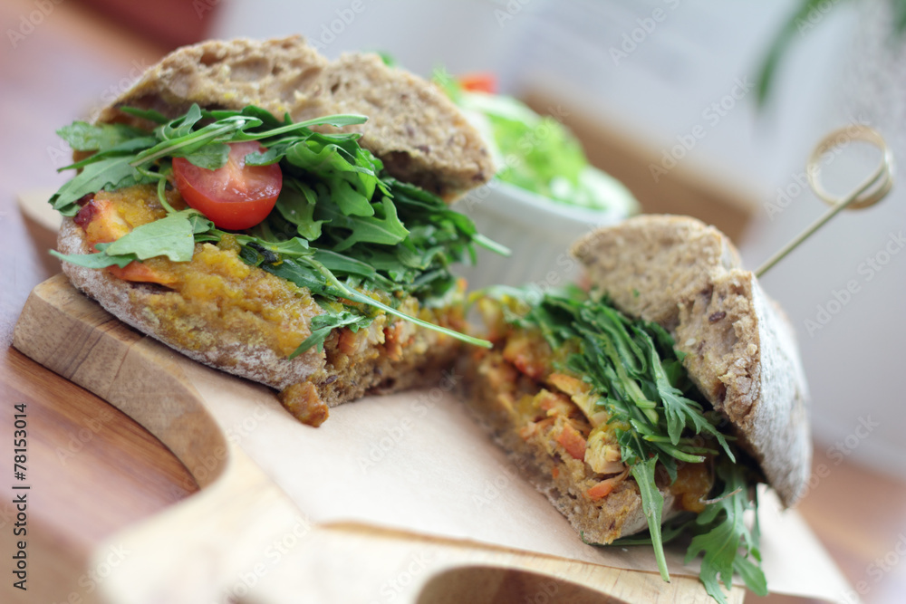Bombay masala sandwich with chicken, rocket and green salad. Bombay masala sandwich with chicken, rocket and green salad.