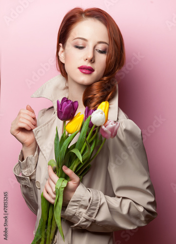 beautiful redhead girl with flowers
