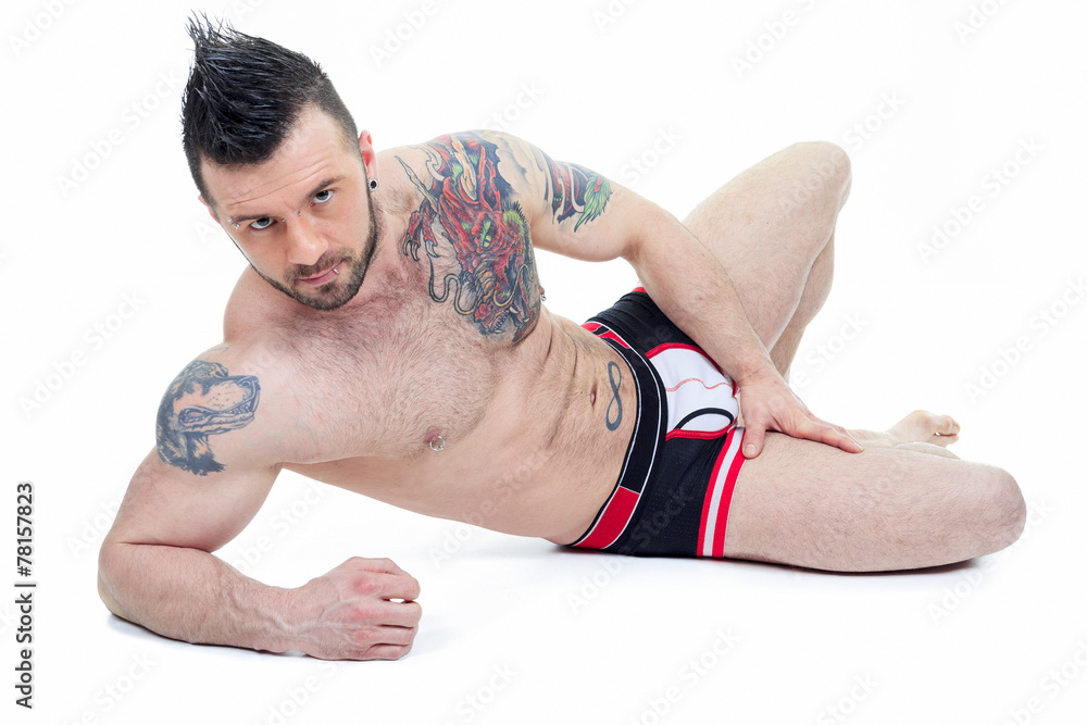 Naklejka premium A Handsome men in underwear over a studio white background