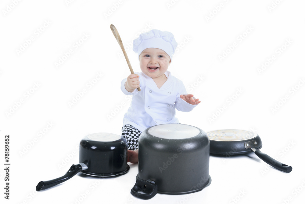 Cute little cook boy in front of a white background Cute little cook boy in front of a white background