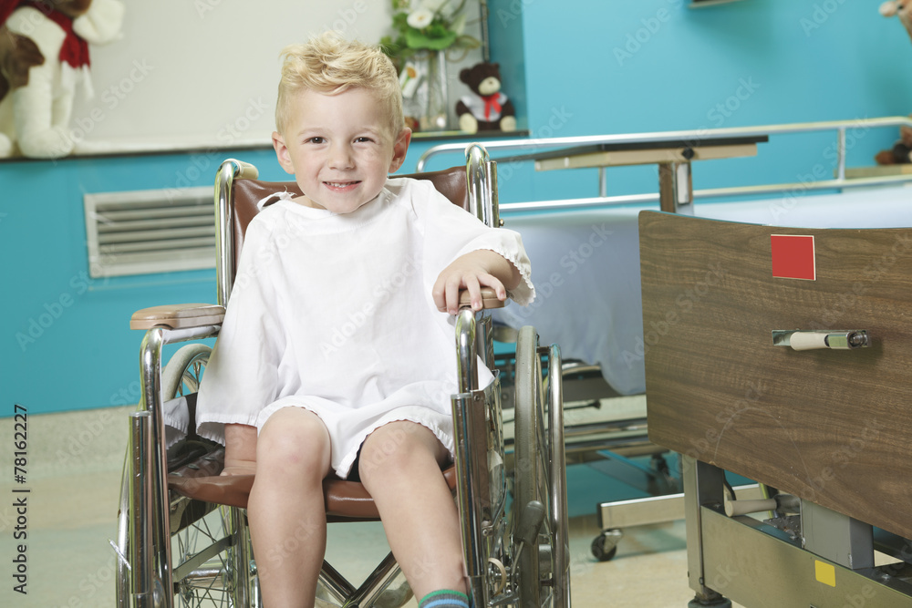 An adorable little boy in the wheelchair at the hospital An adorable little boy in the wheelchair at the hospital