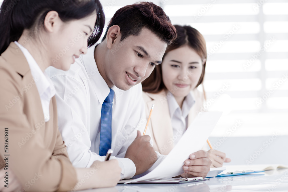 Business people discussing the charts and graphs showing the res Business people discussing the charts and graphs showing the res