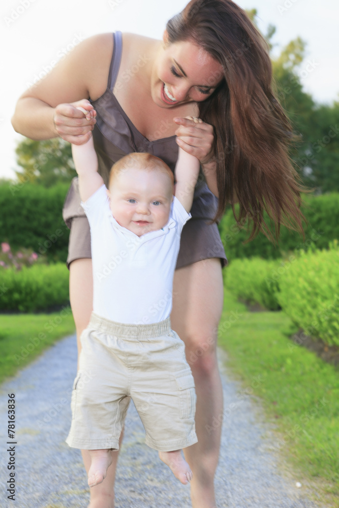 A mother with is baby on a beautiful forest A mother with is baby on a beautiful forest