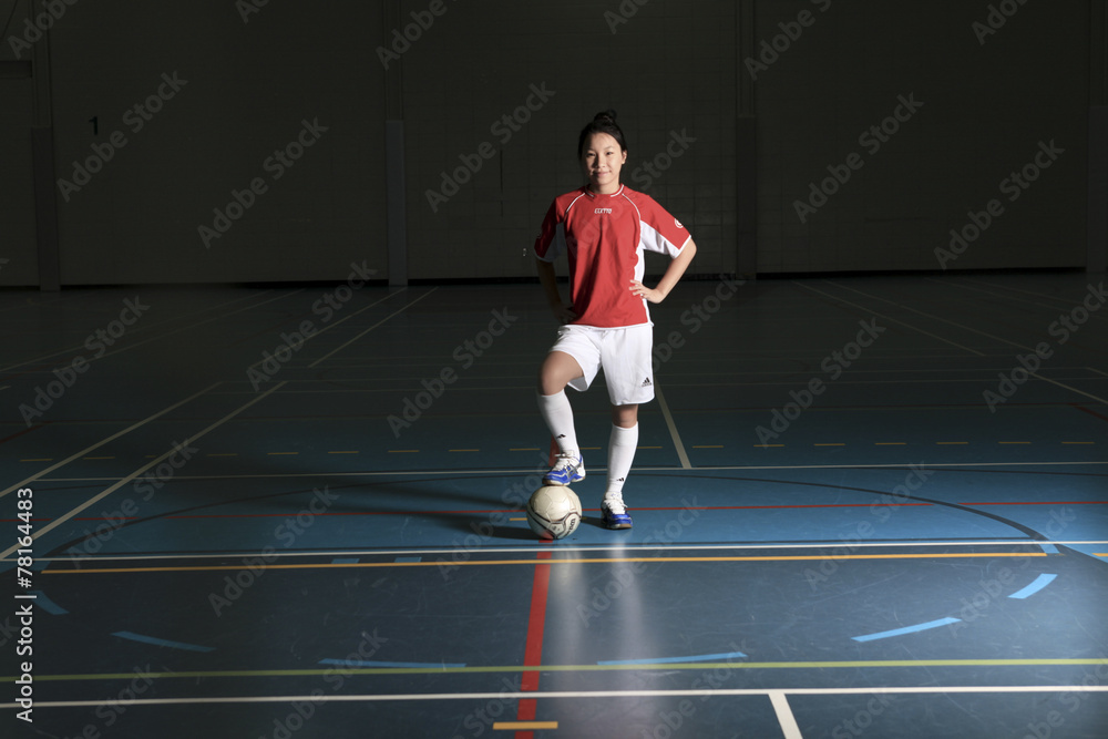 Obraz premium A female soccer player in a stadium
