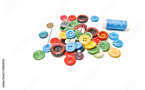 different buttons and spool of thread