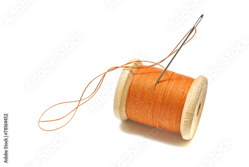 spool of orange thread
