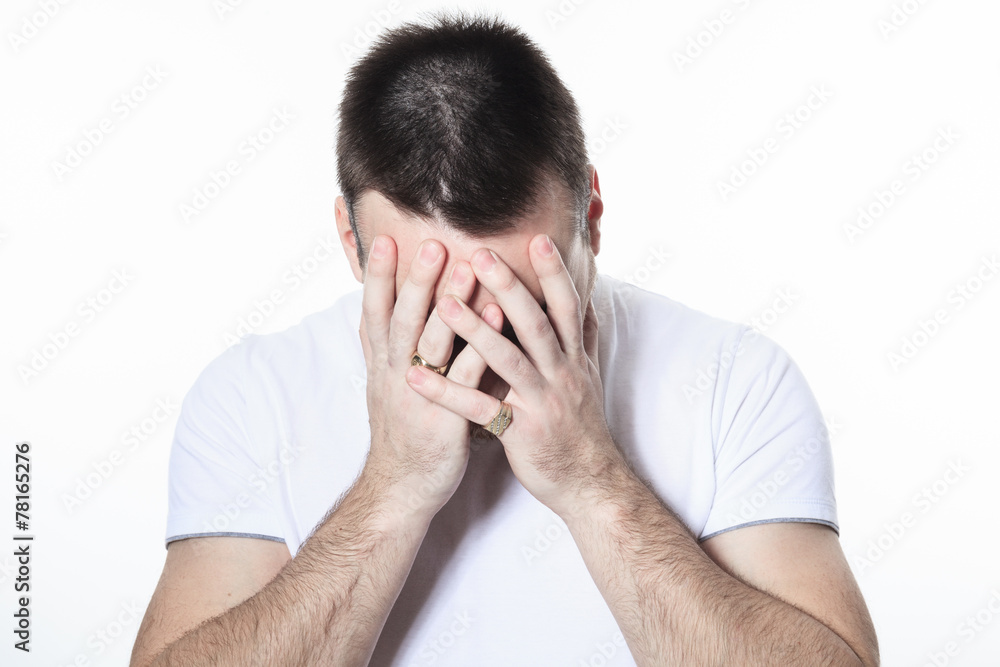 A man having a disturbing problem over white A man having a disturbing problem over white