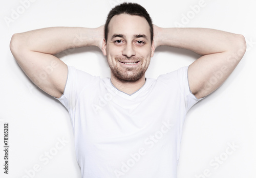 A relax man over a studio white background © Louis-Photo