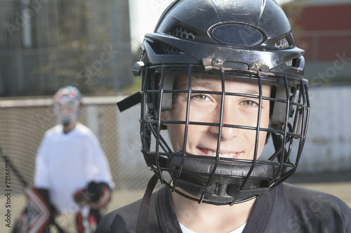 Photography A Portrait of hockey ball player with hockey stick
