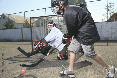 Photography A Portrait of hockey ball player with hockey stick