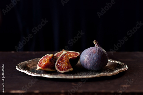 Plate with Figs  on the dark background