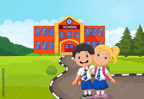 Two happy students standing in front of school building