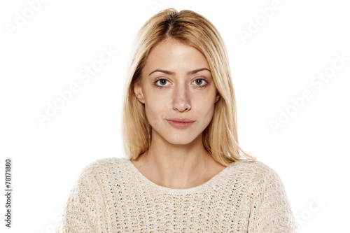 portrait of serious young blonde without make up