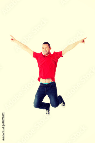 Young casual man jumping.