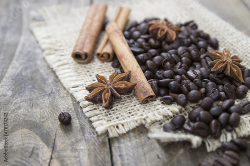 coffee beans and cinamons on the wooden table