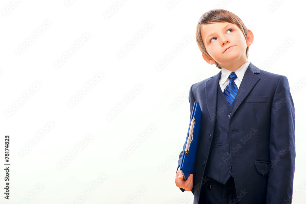 Business child in suit and tie posing with a clipboard Business child in suit and tie posing with a clipboard