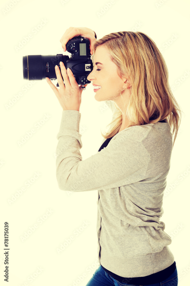Woman photographer with DSLR Woman photographer with DSLR