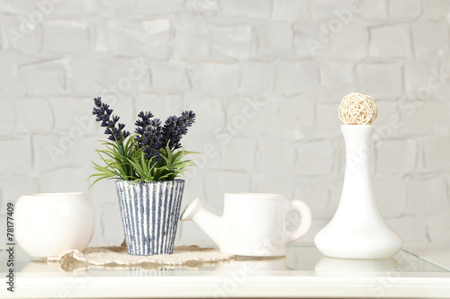 Interior with decorative vases and plant © Africa Studio