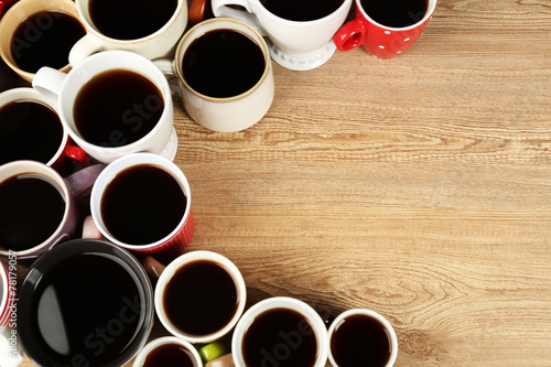 Many cups of coffee on wooden table background, closeup view © Africa Studio