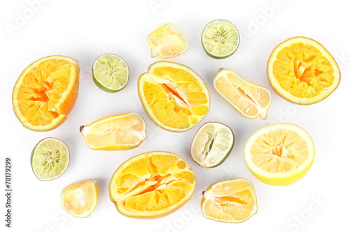Squeezed citrus fruits isolated on white