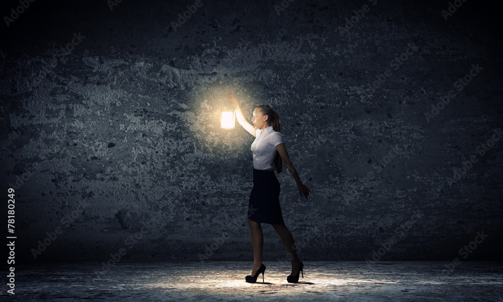 Fototapeta premium Businesswoman with lantern