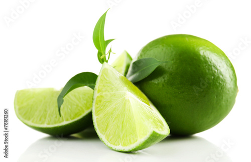 Juicy lime with green with leaves isolated on white © Africa Studio