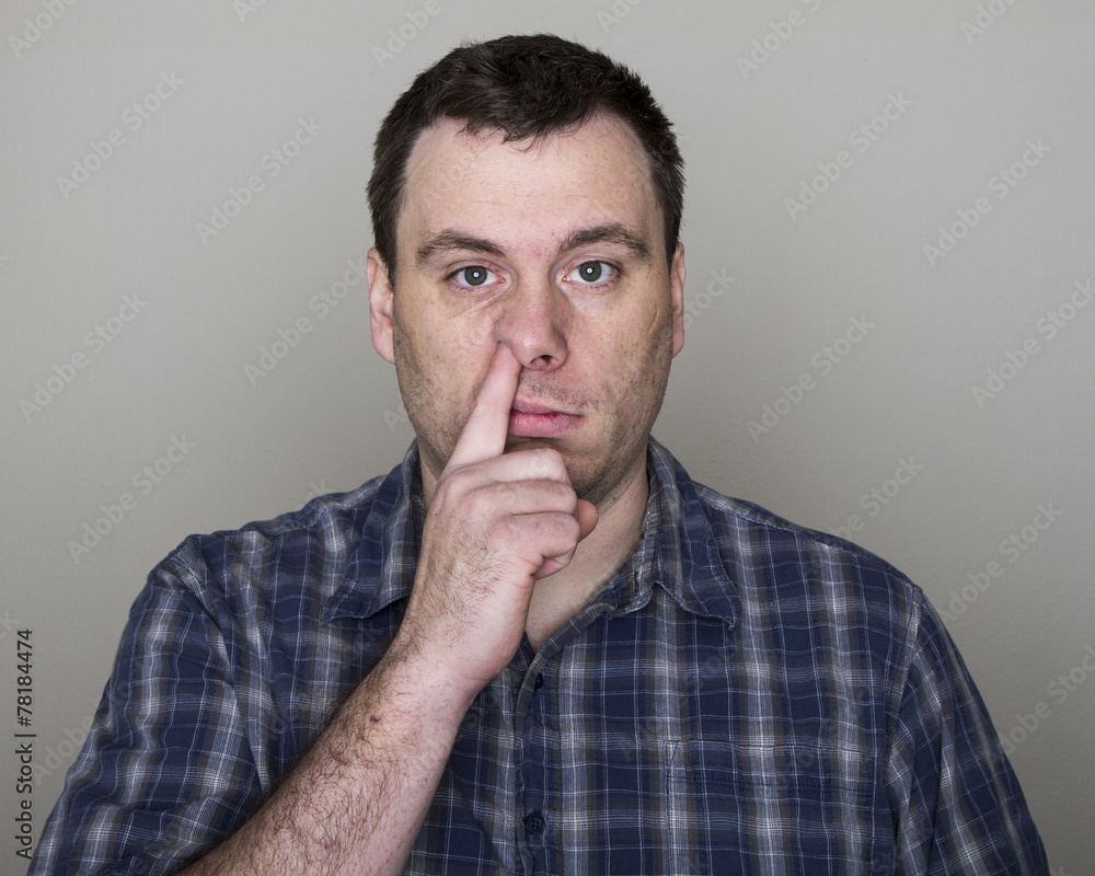 Man digging up his nose