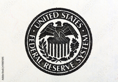 Macro shot of United States Federal Reserve System symbol on old photo