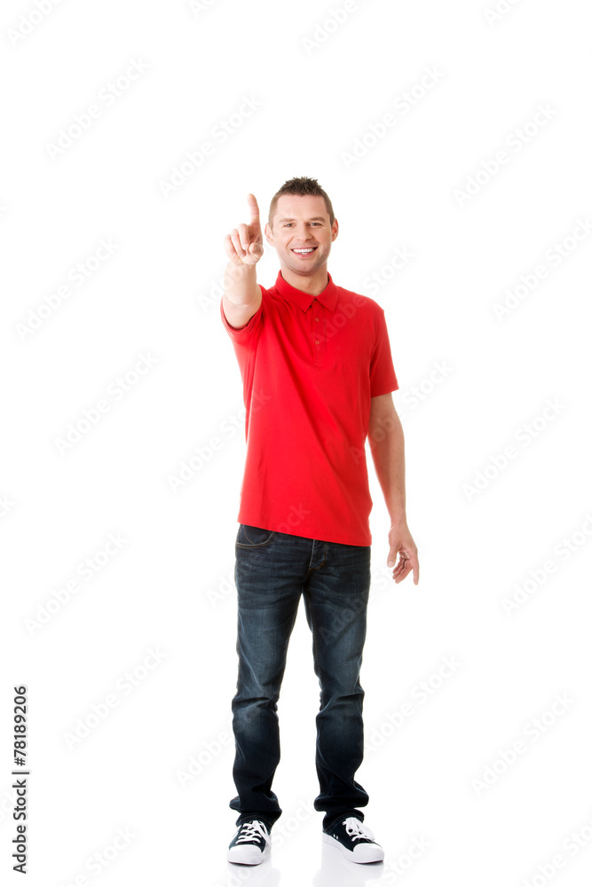 Man pressing an abstract touchscreen button Man pressing an abstract touchscreen button