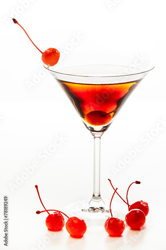 Manhattan cocktail garnished with a cherry photo