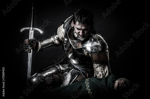 Great knight looking at dead body