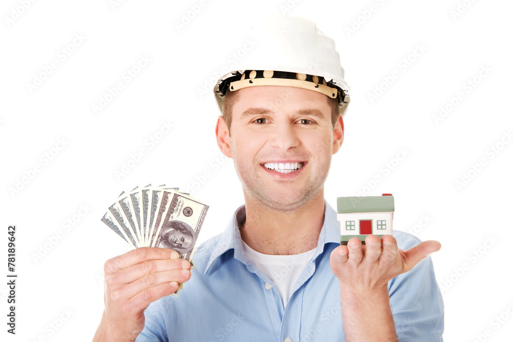 Construction man holding house model and money Construction man holding house model and money