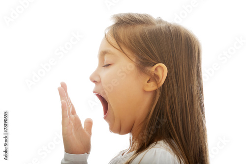Young girl yawning