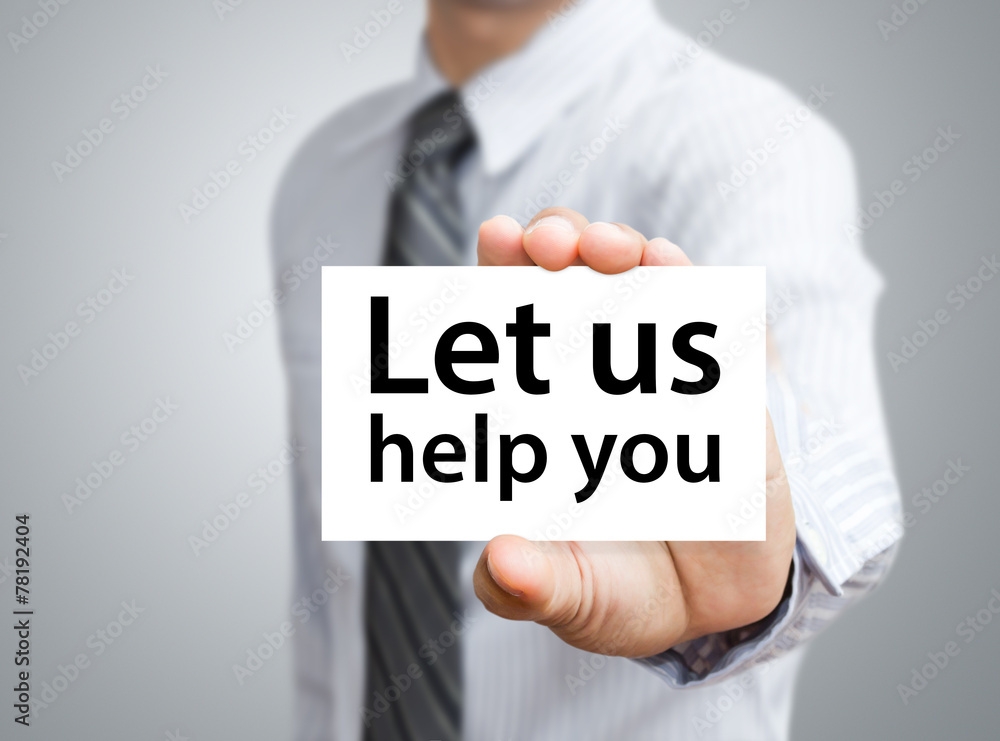 Businessman showing card with Let us help you text Businessman showing card with Let us help you text