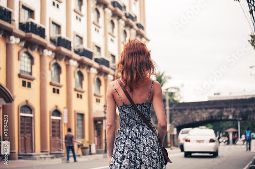 Young woman walking in Manila