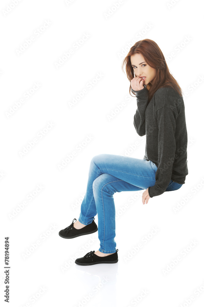 Woman biting her nails Woman biting her nails