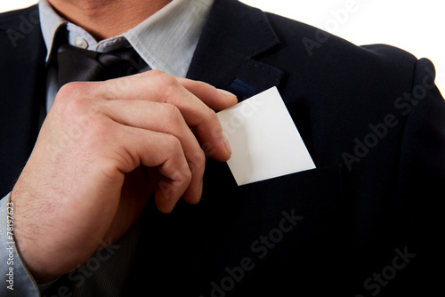 Businessman taking his personal card from pocket.