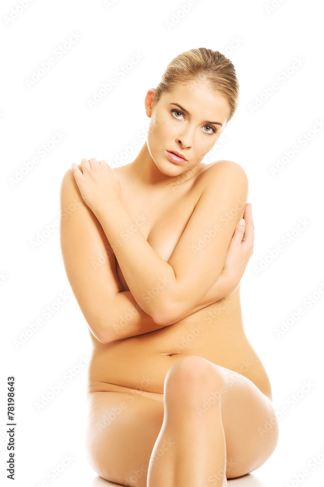 Nude woman sitting