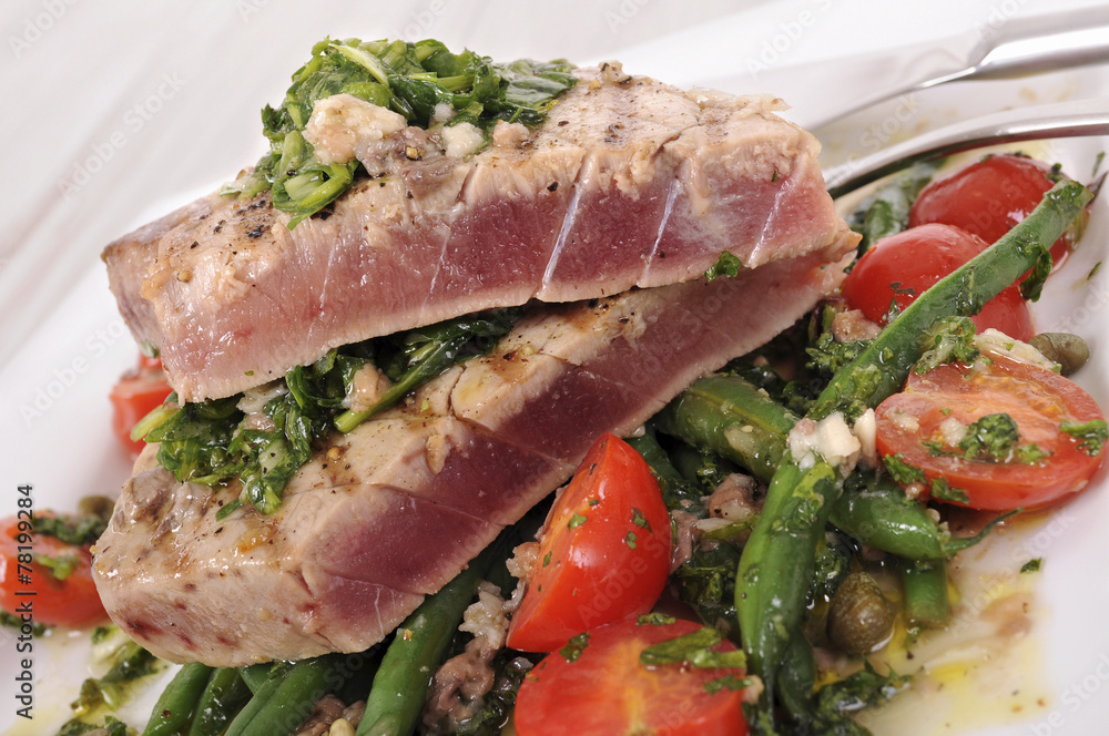 Seared tuna steak with bean and tomato salad