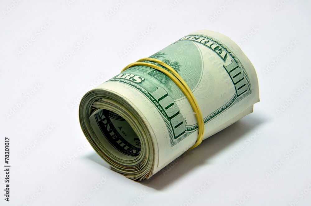 Roll of U.S. banknotes rolled up on white background Roll of U.S. banknotes rolled up on white background