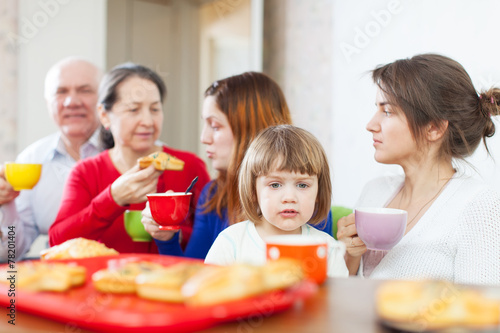  family having breakfast at home together