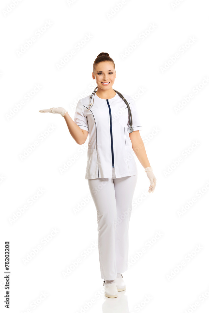 Female doctor presenting copyspace Female doctor presenting copyspace