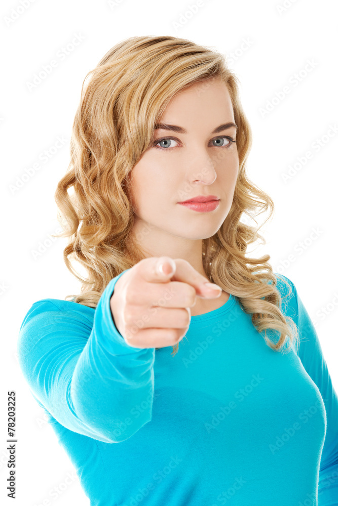 Laughing blonde woman pointing on you Laughing blonde woman pointing on you