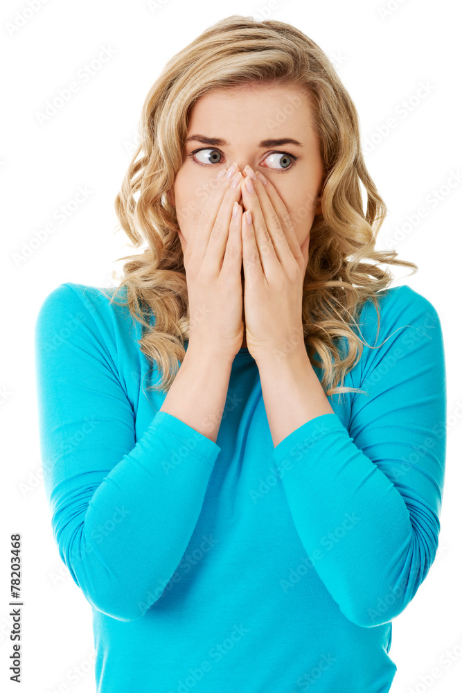 Portrait of a woman clogging nose Portrait of a woman clogging nose