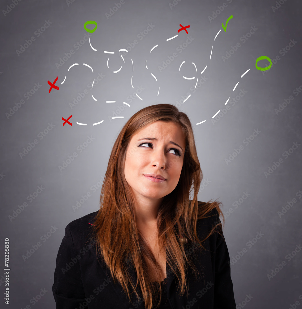 Young woman thinking with abstract marks overhead Young woman thinking with abstract marks overhead
