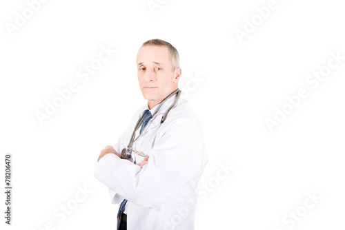 Male doctor with folded arms photo